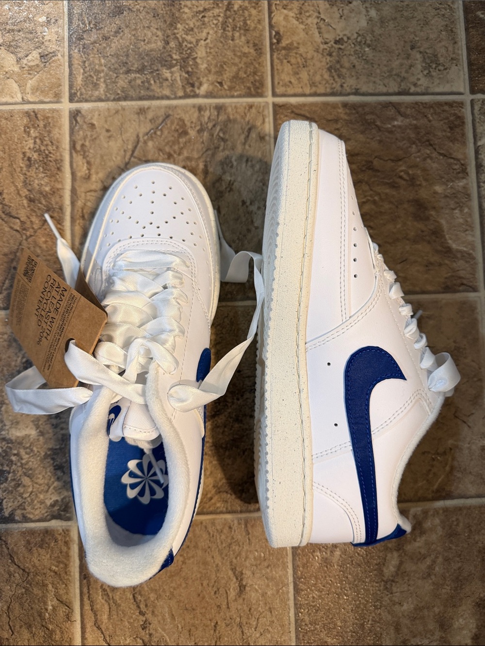 Nike White Low-Top Sneakers with Blue Swoosh - Women's